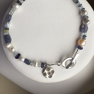 Bracelet — Iolite Aquamarine, Freshwater Pearls, Hill Tribe Village Silver Charm