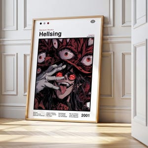 May include: A framed poster with the title "Hellsing". The artwork shows a character with red eyes and a long tongue, surrounded by more red eyes. The poster is in a wooden frame and leans against a white wall.