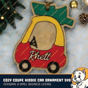 May include: Red and yellow wooden cutout of a kiddie car with a green tree on top. The car has the name "Rhett" written on the side. This is a Christmas ornament.