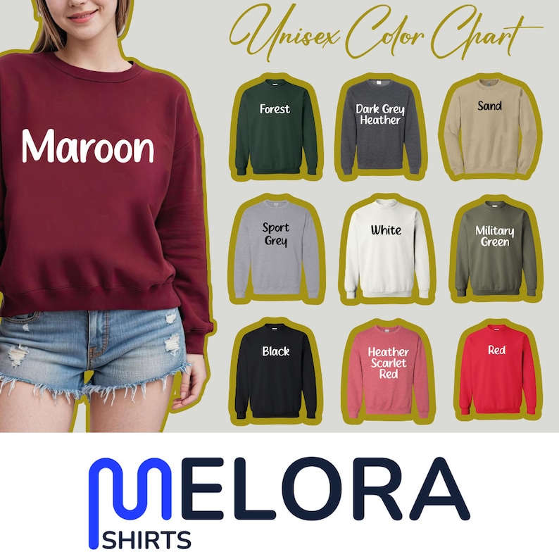 May include: A maroon sweatshirt with the word "Maroon" in white text. The image also displays a colour chart of sweatshirts in various colours, including forest green, dark grey heather, sand, sport grey, white, military green, black, heather scarlet red, and red. The brand logo is at the bottom.