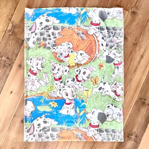 May include: A colorful fabric featuring a pattern of Dalmatian puppies. The puppies are white with black spots and red collars, set against a backdrop of a pond, grass, and a wooden barrel. The design includes butterflies and flowers.