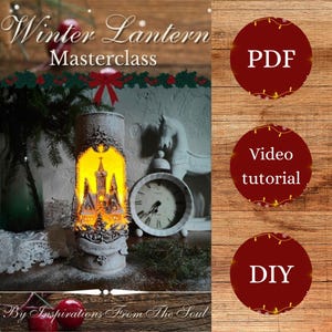 May include: A winter lantern with a castle design, lit from within. The image features the text "Winter Lantern Masterclass" and "By Inspirations From The Soul." Other elements include a clock, a horse figurine, and decorative accents, creating a festive scene.