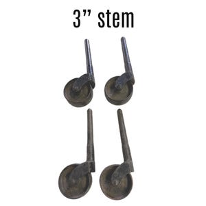 May include: Four black metal caster wheels with a 3" stem. Each wheel has a black rubber tire.