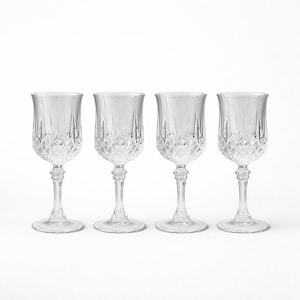 May include: Four clear crystal wine glasses with diamond-cut patterns on the bowls. The glasses have long, slender stems and round bases. The glasses are arranged in a row against a white background, showcasing their elegant design.