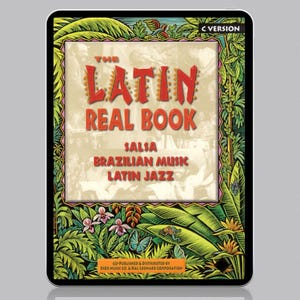 May include: A tablet computer displaying the cover of "The Latin Real Book" with a colorful illustration of tropical plants and a frog. The book features music for salsa, Brazilian music, and Latin jazz. The text "C Version" is visible in the upper right corner.