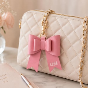 purse charm, bow, bag accessories, coquette, leather bow, handmade leather bow, leather bow purse charm, bow bag charm, leather bag charm, purse charm bow, bow handbag charm, bow keychain charm, purse accessory, handbag charm, cute bag charm, monogram bag charm, custom name keychain, genuine leather, genuine leather bow, genuine leather purse charm, speedy bag charm, coquette, bag bling, purse tassels