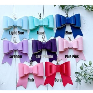 purse charm, bow, bag accessories, coquette, leather bow, handmade leather bow, leather bow purse charm, bow bag charm, leather bag charm, purse charm bow, bow handbag charm, bow keychain charm, purse accessory, handbag charm, cute bag charm, monogram bag charm, custom name keychain, genuine leather, genuine leather bow, genuine leather purse charm, speedy bag charm, coquette, bag bling, purse tassels