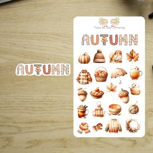 May include: A sheet of autumn-themed stickers with the word "AUTUMN" in a plaid pattern. The stickers feature pumpkins, leaves, acorns, and other fall-related illustrations. The text "Twice As Nice Lettering" is also visible.