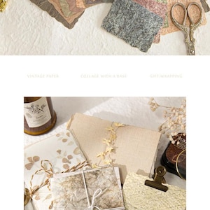 May include: A collection of handmade vintage paper in various earth-tone colors, including brown, beige, and green. The paper has a textured, organic appearance, suitable for collage and gift wrapping. A pair of scissors is also visible.