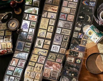 May include: Washi tape rolls with vintage postage stamp designs in various colours. The tape features images of buildings, landscapes, and portraits. Ideal for scrapbooking, journaling, and other crafts.