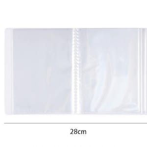 May include: A clear, open photo album with a white spine and binding. The album is 11 inches wide and 6.3 inches tall. The pages are transparent, and the album is empty. The album is on a white background.