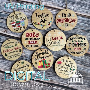 May include: A collection of round wooden Christmas ornaments with various humorous phrases and graphics, including "Dear Santa just being COFFEE" and "Festive AF." Each ornament has a jute string for hanging.