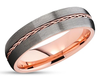 May include: A brushed grey tungsten carbide wedding band with a rose gold braided inlay.