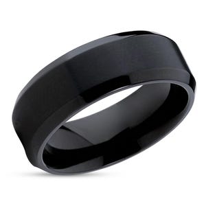 May include: A black, beveled, brushed finish wedding band.