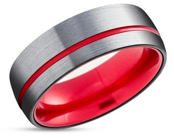 May include: A brushed silver ring with a red stripe around the band. The inside of the ring is also red.