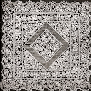 May include: Square white lace doily with intricate floral and leaf patterns. The doily features a central diamond-shaped design and a scalloped edge. The delicate lace is detailed with roses and other floral motifs, creating an elegant and vintage aesthetic.