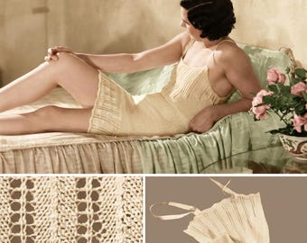 May include: A light yellow knitted slip dress with spaghetti straps. The dress has a delicate openwork design and is worn by a person lying on a bed. The bed has a green satin cover and a floral arrangement is nearby.