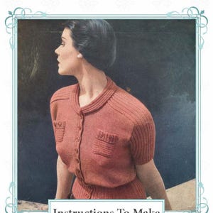 May include: Vintage Visage pattern featuring a woman in a coral-colored knitted cardigan with short sleeves and two front pockets. The image includes the text "Instructions To Make" and "1940s Knitting Pattern". The design is framed with a decorative border.