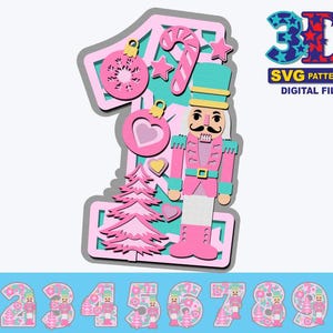 May include: A pink and green 3D layered SVG file of the number one with a nutcracker, candy cane, and Christmas tree decorations. The file is for digital download and is labeled "3D SVG Patterns Digital File".