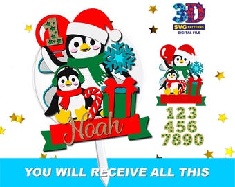 May include: A Christmas-themed cake topper featuring two penguins wearing Santa hats and scarves. The design includes a snowflake, a gift box, and the name "Noah" on a red banner. The image also shows numbers 1-9 and the text "YOU WILL RECEIVE ALL THIS".