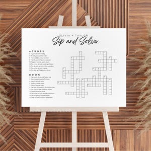May include: A printable crossword puzzle game with the title "Sip and Solve" and the names Olivia and Taylor. The crossword puzzle is designed for a wedding or engagement party.