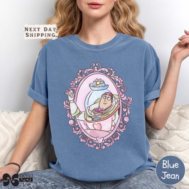 a woman sitting on a couch wearing a blue shirt