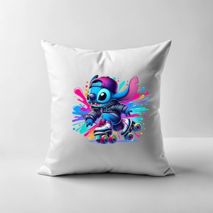 May include: White cushion featuring a blue cartoon character on roller skates. The character is wearing a black jacket and a blue hat. The background is a colourful splatter pattern.