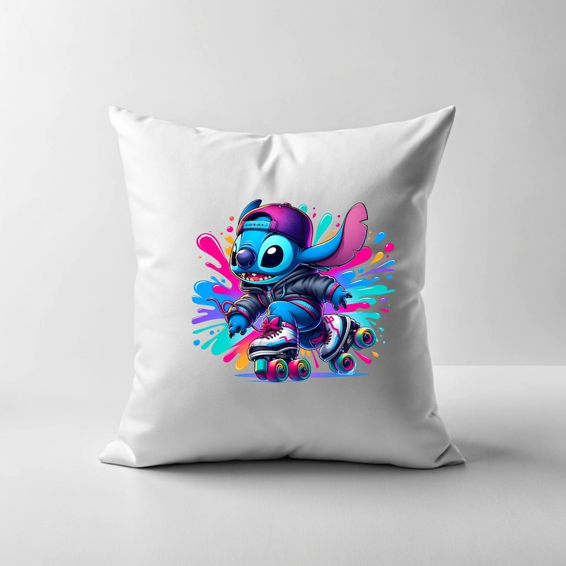 May include: White cushion featuring a blue cartoon character on roller skates. The character is wearing a black jacket and a blue hat. The background is a colourful splatter pattern.