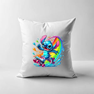 May include: A white pillow featuring a blue Stitch character on roller skates. Stitch is skating on a rainbow with water splashing around him.
