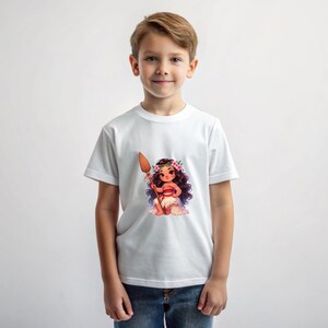 May include: A white t-shirt with a cartoon image of a young girl with brown hair wearing a flower crown and a red and brown skirt. The girl is holding a wooden spear and is standing on a brown rock.