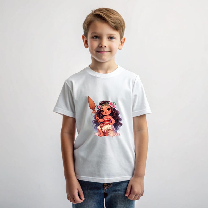 May include: A white t-shirt with a cartoon image of a young girl with brown hair wearing a flower crown and a red and brown skirt. The girl is holding a wooden spear and is standing on a brown rock.