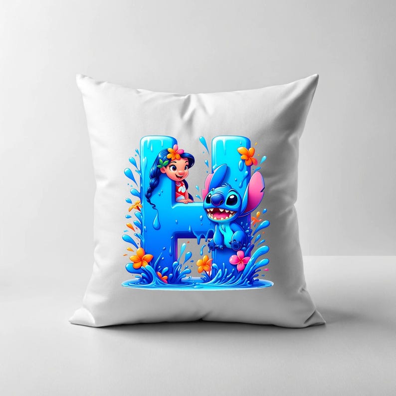 May include: White pillow with a blue and orange graphic of Stitch and Lilo from Disney's Lilo & Stitch. The graphic shows Stitch and Lilo in a pool of water with the letter H in the background.