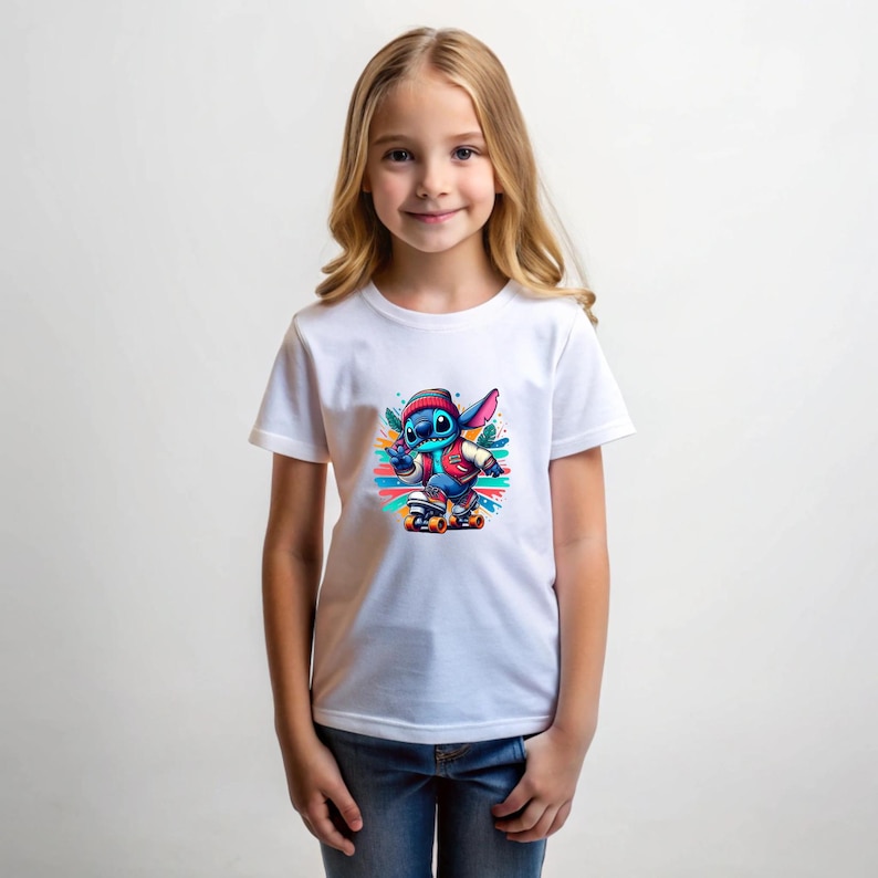 May include: A white t-shirt featuring a colourful graphic of a blue cartoon character skateboarding. The character is wearing a red jacket and a hat. The background is a colourful abstract design.