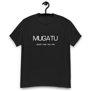 May include: Black t-shirt with white text that reads "MUGATU LONDON - PARIS - NEW YORK"