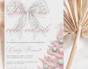 May include: A baby shower invitation with the text "Baby it's cold outside" in elegant script. The design features a pink Christmas tree adorned with ornaments and a large bow. The invitation includes details for Emily Bennett's baby shower.