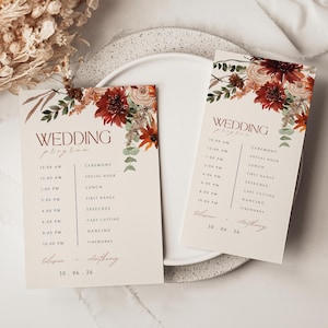 May include: Two rectangular wedding program cards on a cream background with dark red and orange floral watercolor illustrations at the top. The text reads Wedding Program, a schedule from 10:00 AM to 10:00 PM, Olivia + Anthony, and 30.06.26.