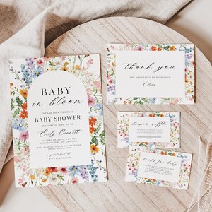 May include: Baby shower stationery set with floral borders. The invitation reads "Baby in Bloom" and includes event details. Additional cards say "Thank You", "Diaper Raffle", and "Books for Baby".