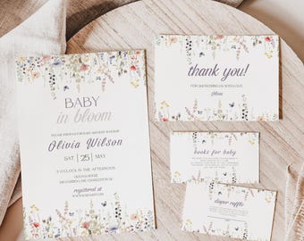 May include: A set of baby shower stationery with floral accents. The invitation reads "Baby in Bloom" and includes event details. Additional cards say "thank you," "books for baby," and "diaper raffle."