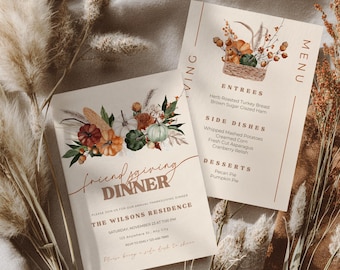 May include: Two beige Friendsgiving dinner invitations and menu cards. The invitation features a floral arrangement with pumpkins and the text "Friendsgiving Dinner". The menu card lists entrees, side dishes, and desserts.
