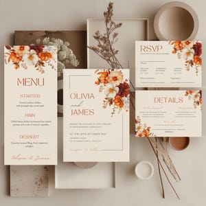May include: A collection of wedding stationery featuring floral designs in orange, white, and burgundy. The set includes a menu, invitation, RSVP, and details card, with text such as "Olivia and James" and "RSVP".
