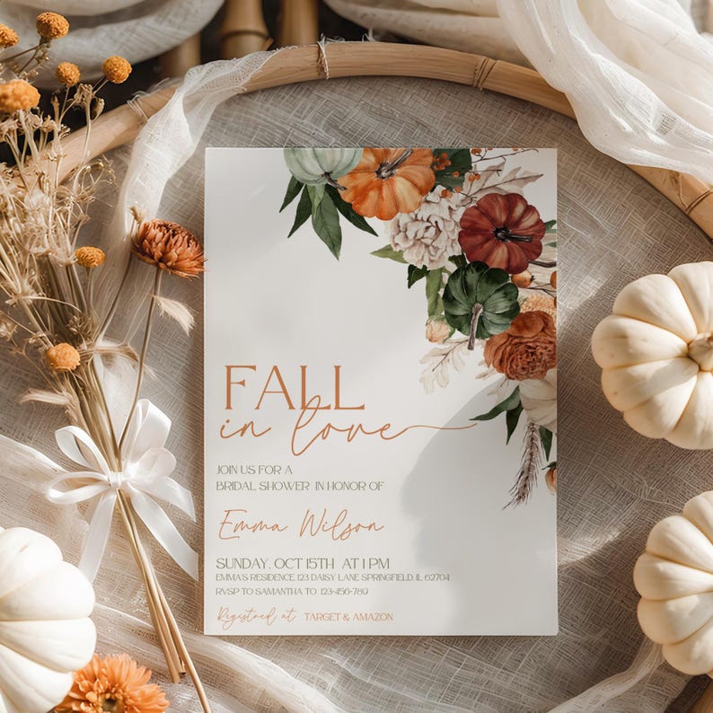 May include: A bridal shower invitation with the text "Fall in Love" and floral and pumpkin accents. The invitation includes details for Emma Wilson's bridal shower, with a date, time, and location. The design features pumpkins in shades of orange, green, and white.