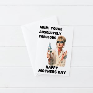 May include: A white Mother's Day card featuring a cartoon illustration of a woman with sunglasses, holding a bottle and cigarette. The card reads "MUM, YOU'RE ABSOLUTELY FABULOUS" and "HAPPY MOTHERS DAY" in black text. An envelope is behind.