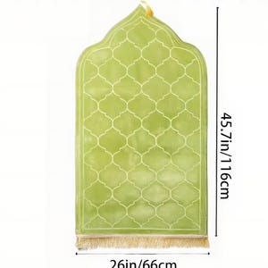 May include: A light green prayer rug with a lattice pattern and a decorative top. The rug is 45.7 inches (116 cm) long and 26 inches (66 cm) wide, with a gold fringe at the bottom. A gold loop is at the top.