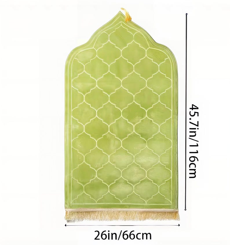 May include: A light green prayer rug with a lattice pattern and a decorative top. The rug is 45.7 inches (116 cm) long and 26 inches (66 cm) wide, with a gold fringe at the bottom. A gold loop is at the top.