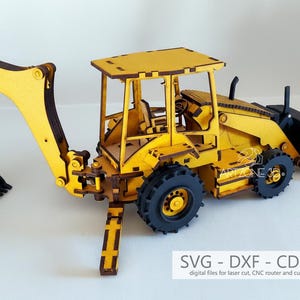 May include: A yellow and black wooden toy backhoe loader. The model features a detailed cab, wheels, and a movable arm with a bucket. The image includes the text "SVG - DXF - CDR - AI" and "digital files for laser cut, CNC router and cutting machine."