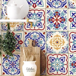 May include: A kitchen backsplash featuring a decorative tile pattern in blue, red, yellow and white. The tiles have a geometric design with intricate details.