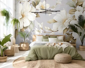 May include: A bedroom with a white floral mural on the wall, a green duvet cover on the bed, and a woven rug on the floor. There are three small dogs lying on the bed.