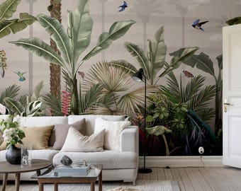 May include: A white sofa with pillows sits in front of a wall mural depicting a lush tropical jungle scene with palm trees, banana leaves, and colorful birds.