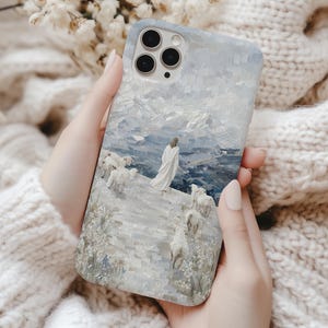 Christian phone case with Jesus leaving the 99 sheep to find the one lost sheep, mountain scene in 3D mosaic style, fits iPhone and Samsung.
