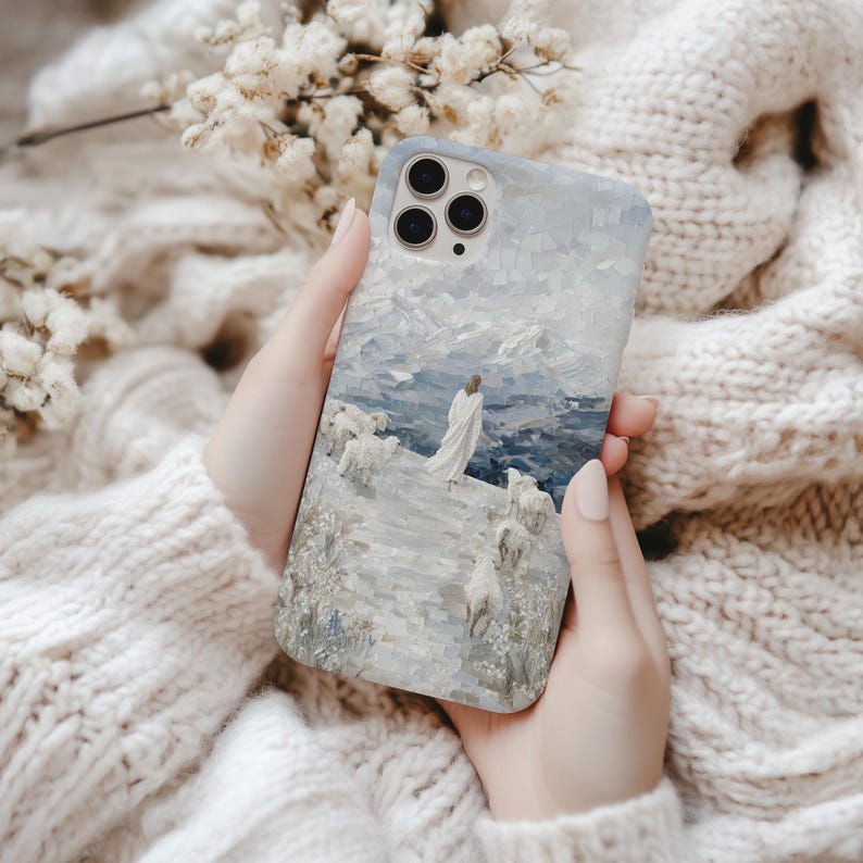 Christian phone case with Jesus leaving the 99 sheep to find the one lost sheep, mountain scene in 3D mosaic style, fits iPhone and Samsung.